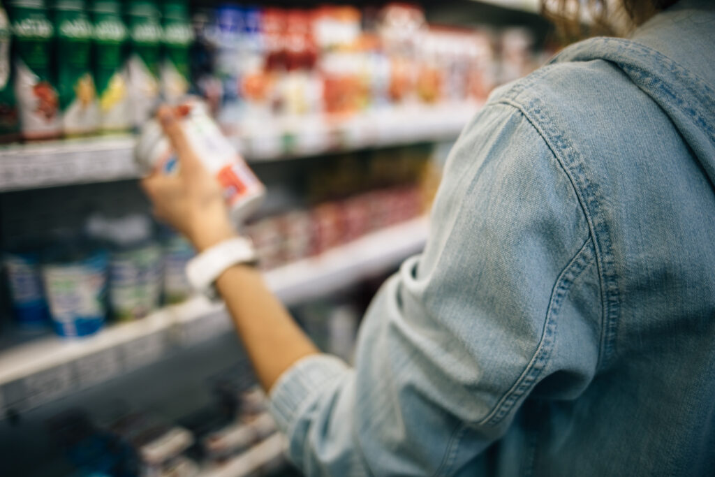 Consumer looking at canned good