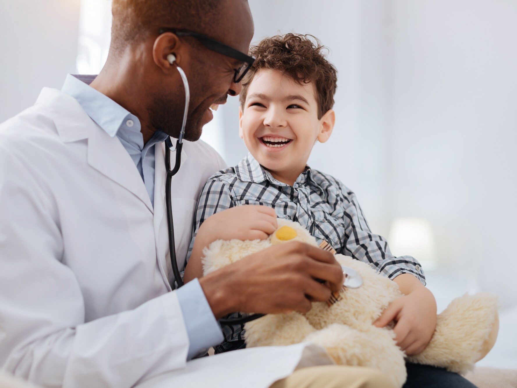 A doctor helping a child